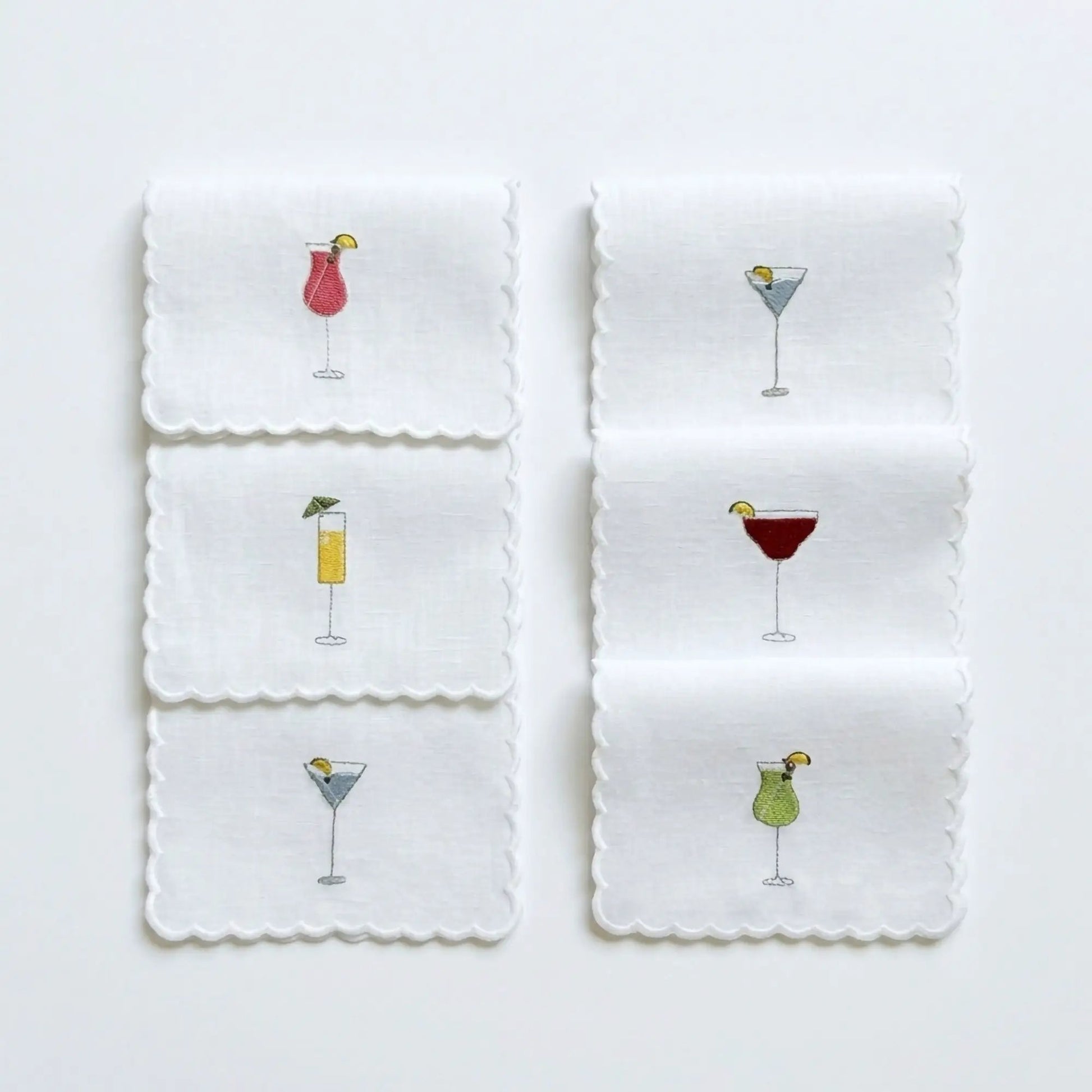 Embroidered cocktail napkins set of six, white with scalloped edges and colorful drink motifs on Tampa Home & Garden Store