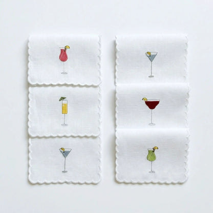 Embroidered cocktail napkins set of six, white with scalloped edges and colorful drink motifs on Tampa Home & Garden Store