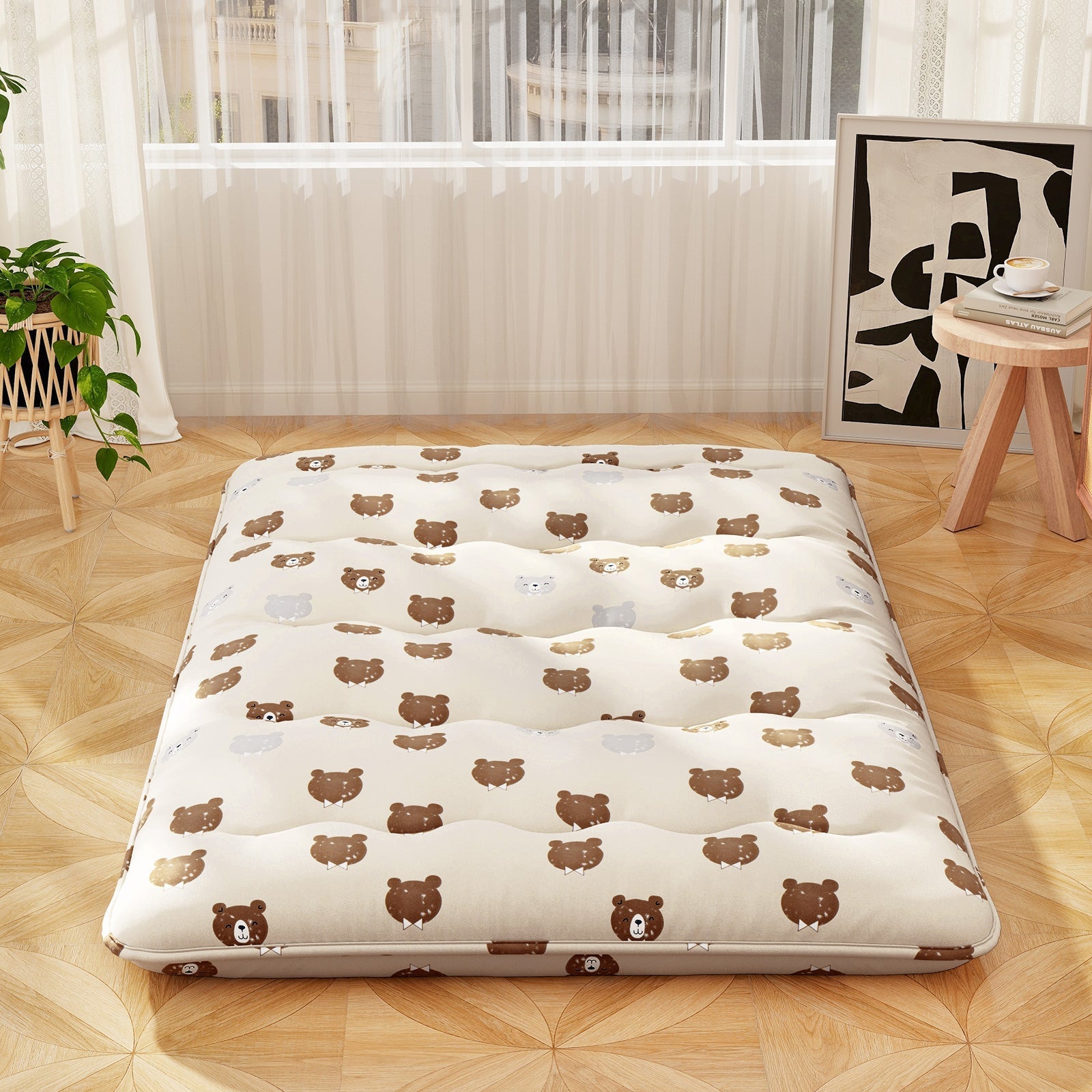 Foldable futon mattress with bear-print washable cover laid on light wood floor in bright room on Tampa Home & Garden Store