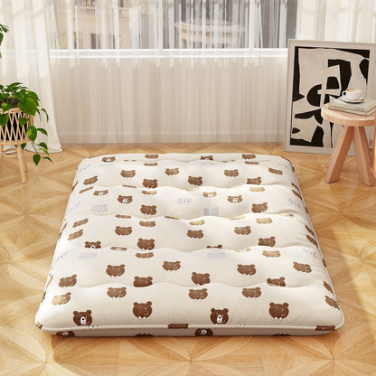 Foldable futon mattress with bear-print washable cover laid on light wood floor in bright room on Tampa Home & Garden Store