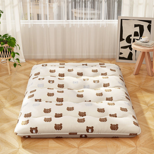Foldable futon mattress with bear-print washable cover laid on light wood floor in bright room on Tampa Home & Garden Store