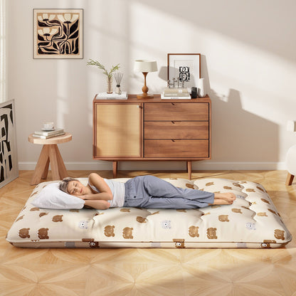GemGear foldable futon mattress with washable beige cover on a wooden floor with a sleeper on Tampa Home & Garden Store