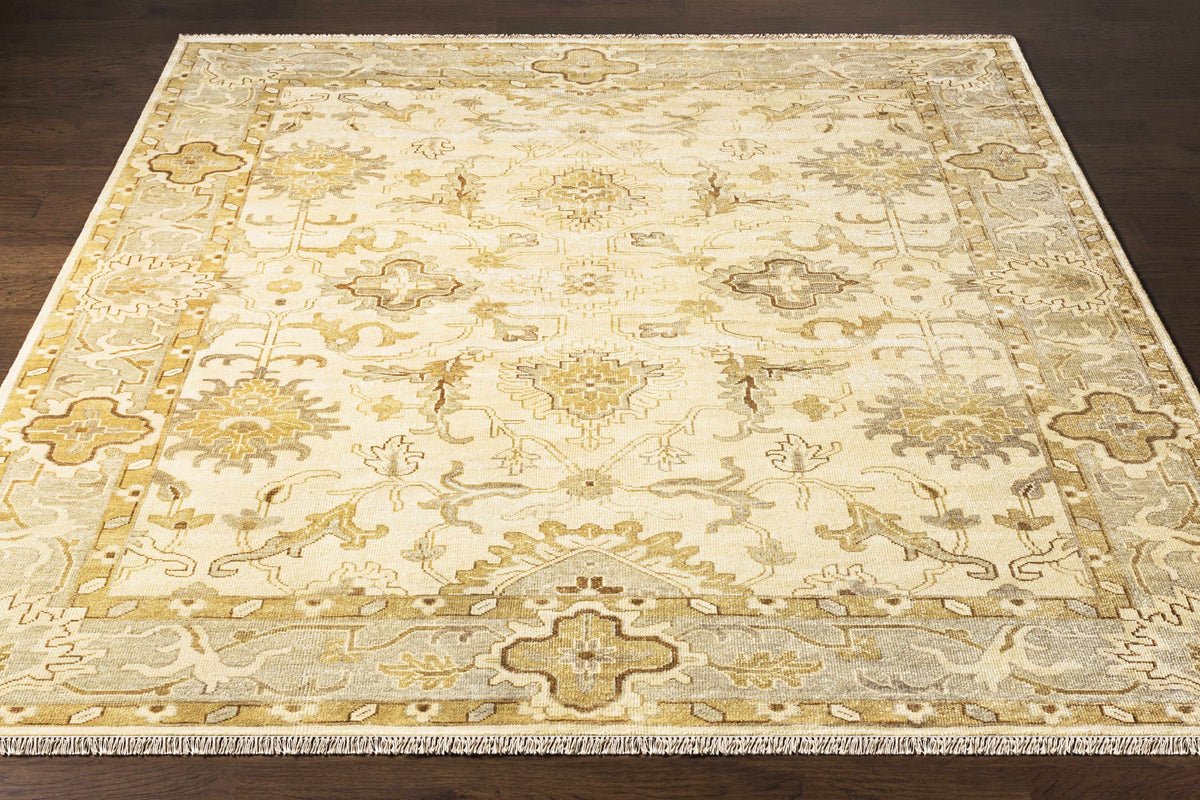 Colebrook Carpet rug by Boutique Rugs in cream with gold-gray ornate motifs and bordered edges on Tampa Home & Garden Store