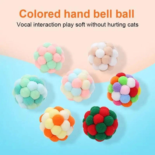 Colorful handmade cat toy ball with fluffy pom-poms in assorted colors for interactive play on Tampa Home & Garden Store