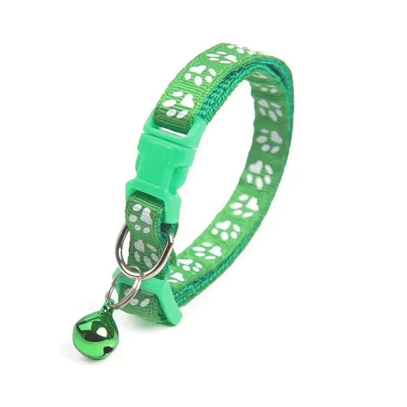 Green paw-print adjustable nylon dog collar with buckle, metal ring and green charm on Tampa Home & Garden Store