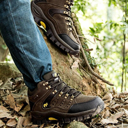 Stevvex brown waterproof hiking boots with rugged outsole and yellow accents, two boots on Tampa Home & Garden Store