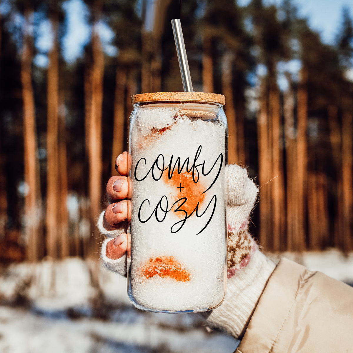 Comfy Cozy 17oz travel mug with clear glass body, wooden lid, metal straw, snow design on Tampa Home & Garden Store