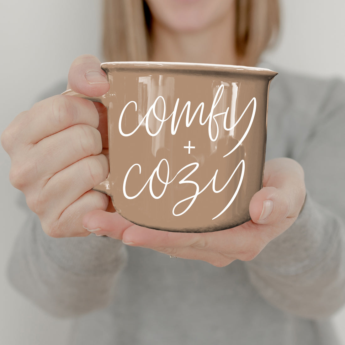 Coffee mug tan glaze with white Comfy + Cozy script on Tampa Home & Garden Store