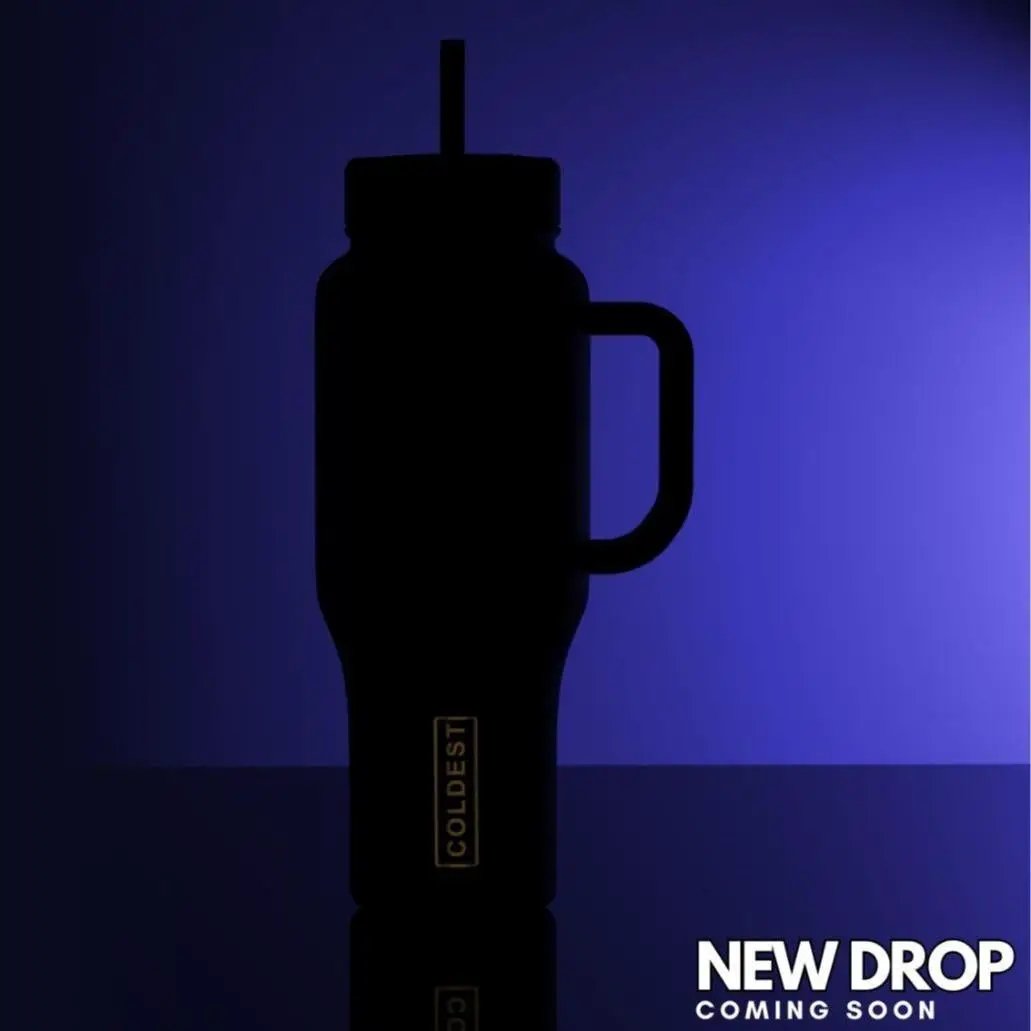 Coldest 36oz water bottle with black body and side handle silhouette on purple gradient on Tampa Home & Garden Store