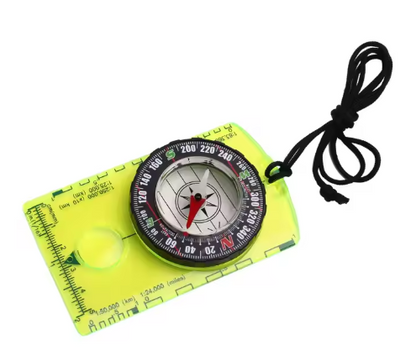 Backpacking compass on neon yellow baseplate with ruler scales and black lanyard on Tampa Home & Garden Store