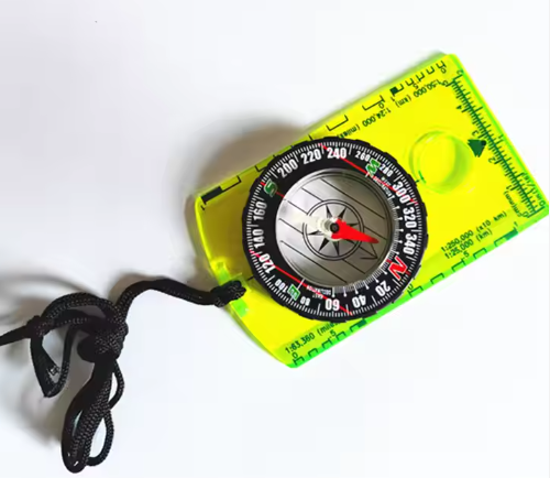 Backpacking compass River Country Gear neon yellow baseplate with black lanyard and red needle on Tampa Home & Garden Store