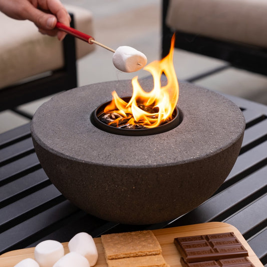 Concrete semi-round fire pit City Bonfires brown textured finish with marshmallows roasting on Tampa Home & Garden Store