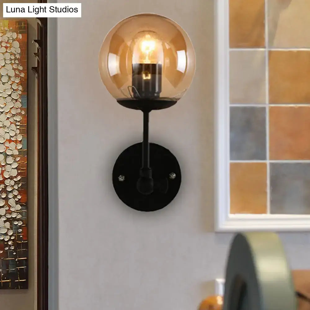 Black amber glass globe sconce with black metal mount by Decorbites for Home & Garden on Tampa Home & Garden Store