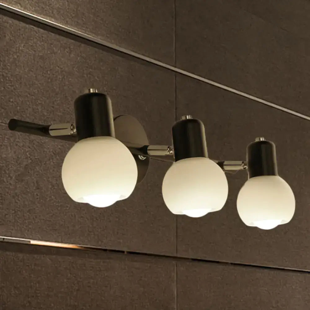 Black chrome globe sconce with three frosted glass globes on Tampa Home & Garden Store