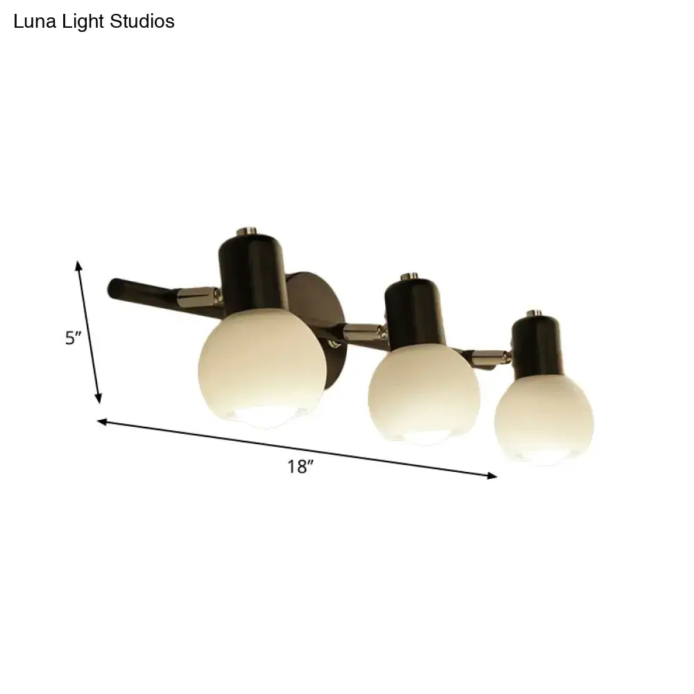 Black chrome globe sconce, three-light wall fixture with frosted glass globes by Decorbites on Tampa Home & Garden Store