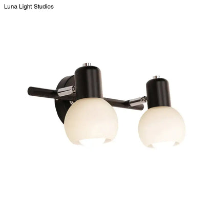 Black chrome globe sconce by Decorbites, dual frosted glass shades, wall-mount fixture on Tampa Home & Garden Store