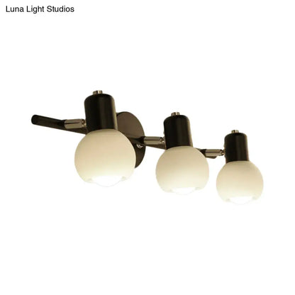 Black Chrome Globe Sconce by Decorbites with three frosted glass globes on Tampa Home & Garden Store