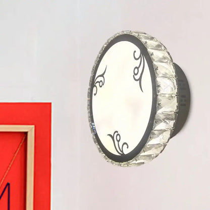 Black circular crystal sconce with faceted crystal rim and decorative black mount by Decorbites on Tampa Home & Garden Store
