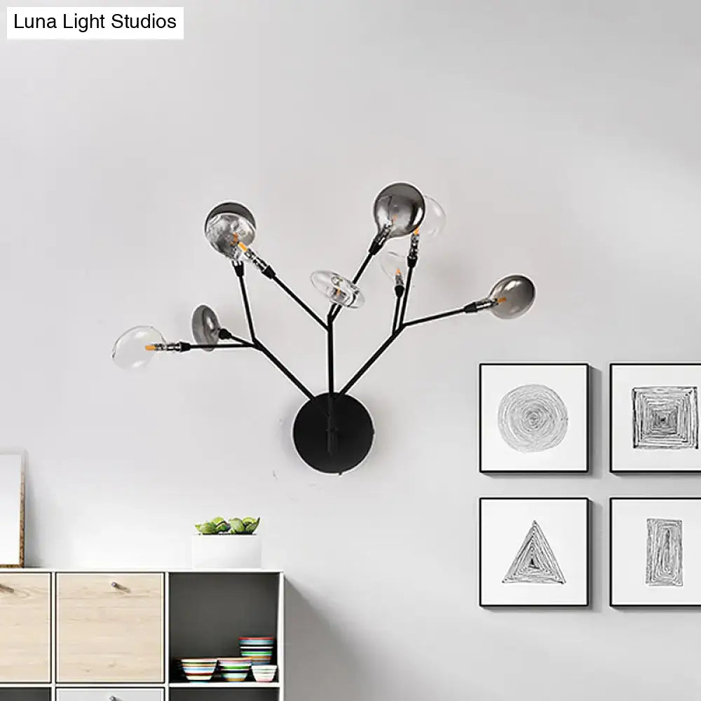 Black branching wall lamp by Decorbites with multiple arms and clear bulbs, wall-mounted base on Tampa Home & Garden Store