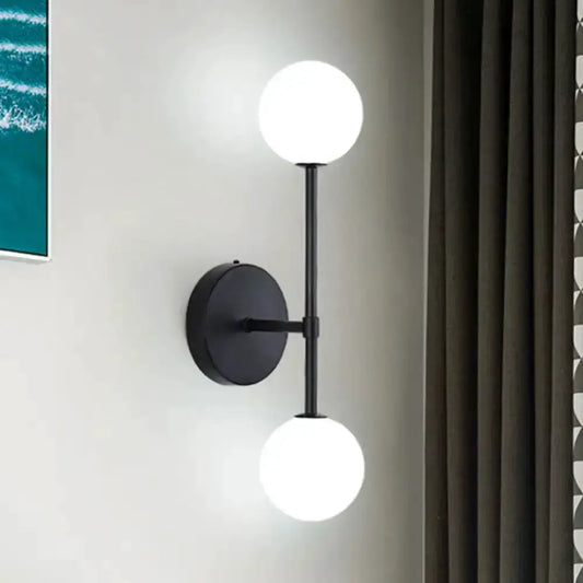 Contemporary black dual-ball wall lamp with two white globes for the bedroom Decorbites on Tampa Home & Garden Store