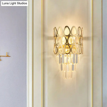 Black teardrop crystal sconce with gold-tone frame and hanging prisms by Decorbites on Tampa Home & Garden Store