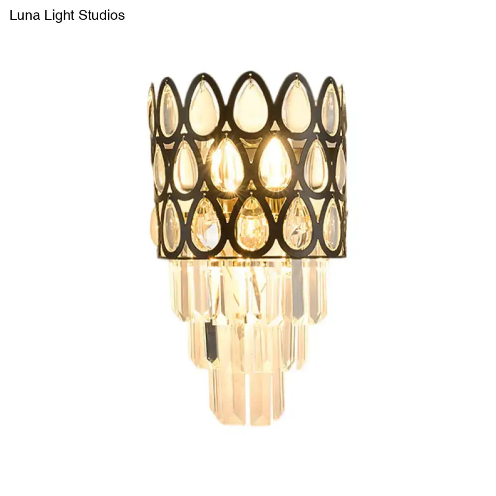 Black teardrop crystal sconce with a black metal openwork frame and cascading prisms Decorbites on Tampa Home & Garden Store