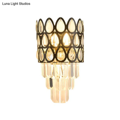 Black teardrop crystal sconce with a black metal openwork frame and cascading prisms Decorbites on Tampa Home & Garden Store