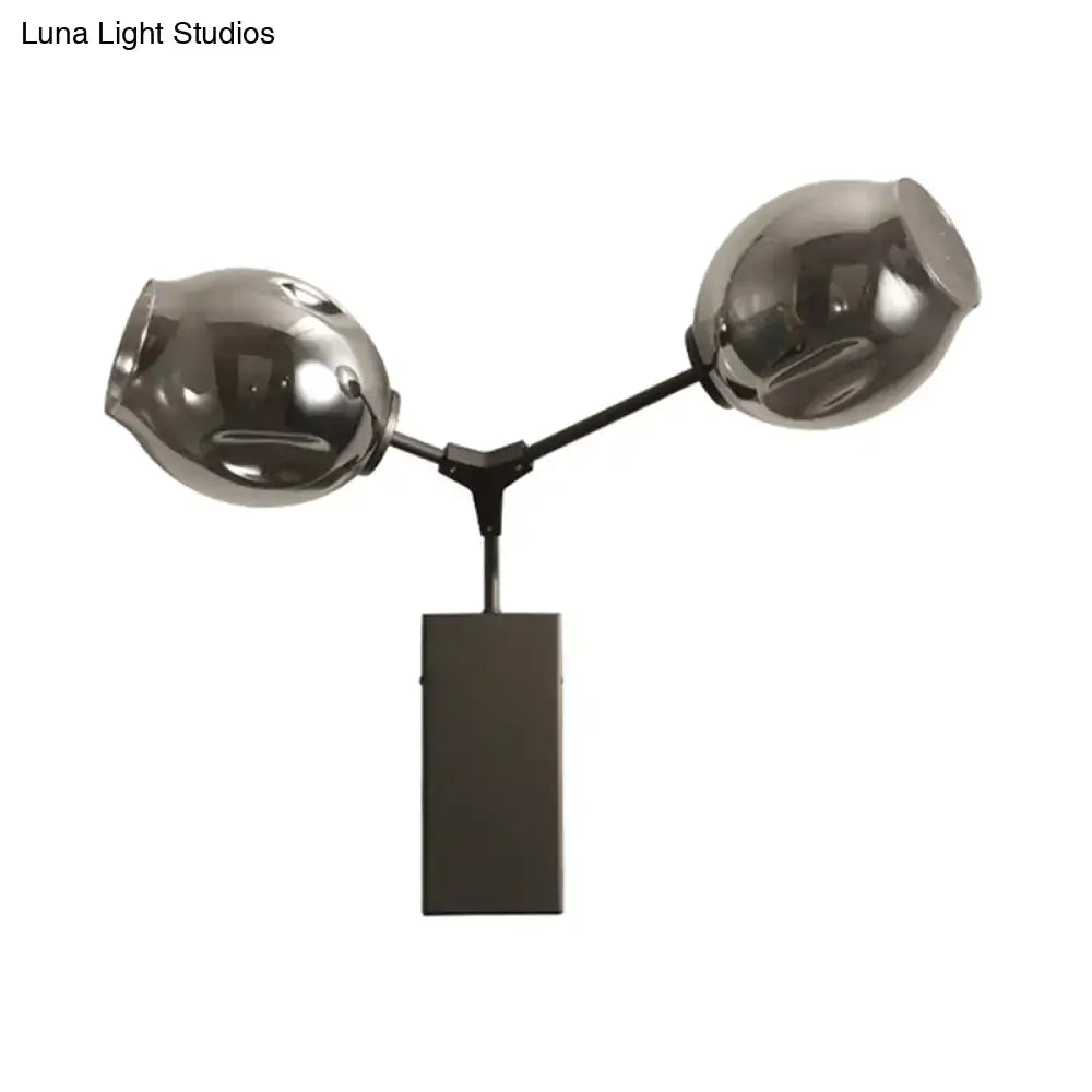 Dual-globe black-gold clear-glass wall sconce on black metal Y-arm with rectangular mount on Tampa Home & Garden Store