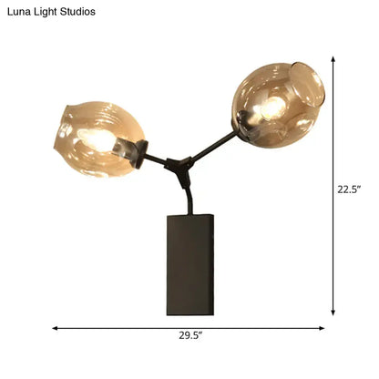 Black Gold Clear-Glass Wall Sconce with amber glass globes on black metal arm Decorbites on Tampa Home & Garden Store