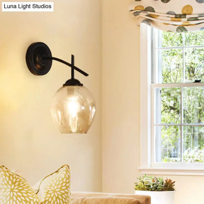 Decorbites Black Gold Clear-Glass Wall Sconce with curved arm and clear globe shade on Tampa Home & Garden Store