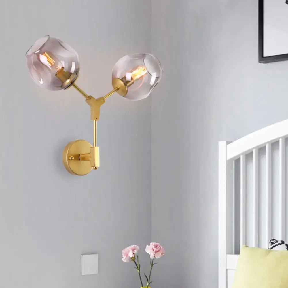 Decorbites black gold clear-glass wall sconce with two glass globes and dual brass arms on Tampa Home & Garden Store