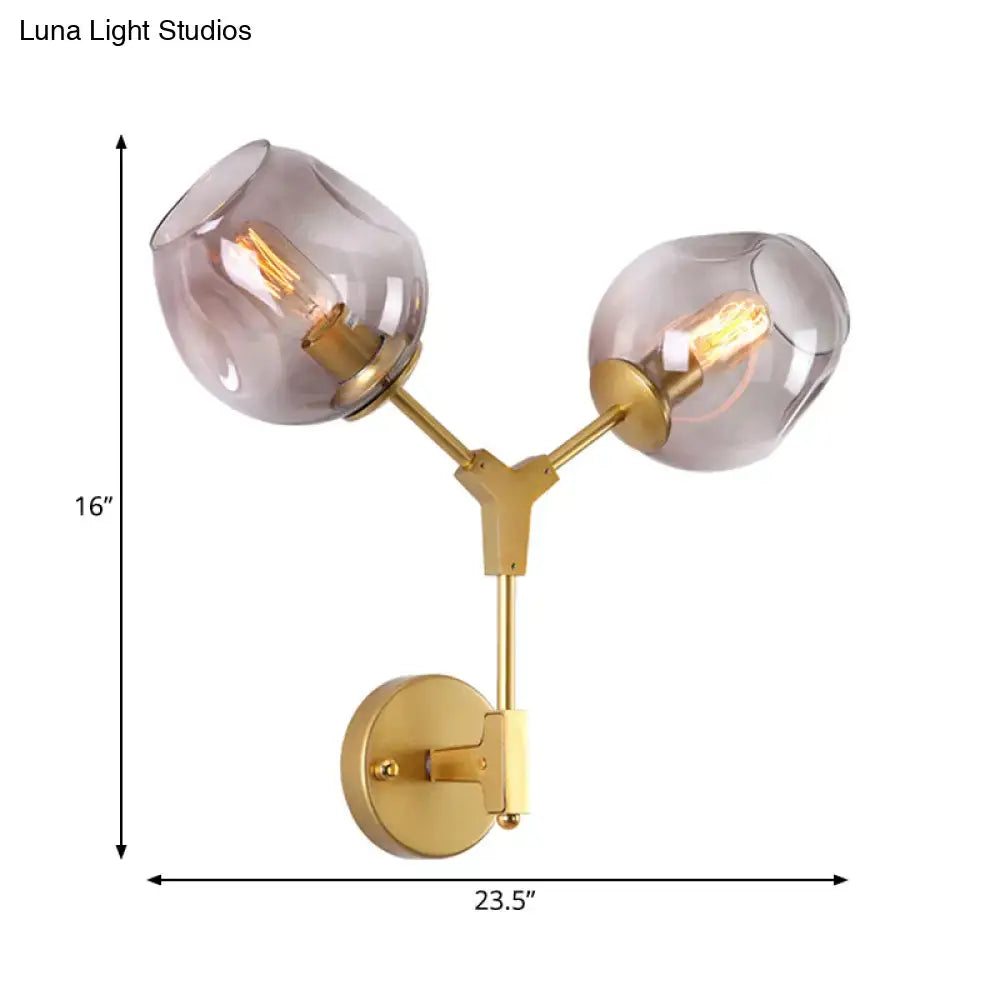 Black Gold Clear-Glass Wall Sconce by Decorbites with dual glass globes on brass arms on Tampa Home & Garden Store