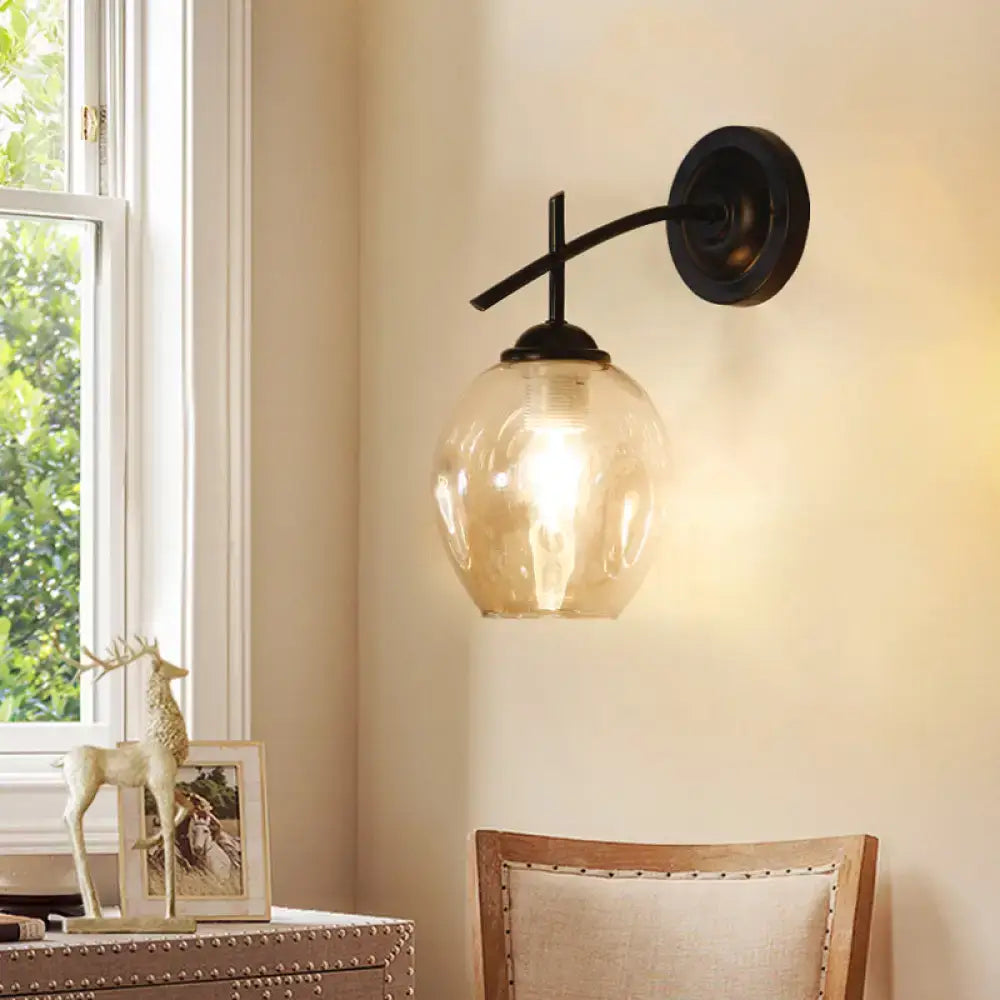 Black Gold Clear-Glass Wall Sconce by Decorbites with curved black arm on Tampa Home & Garden Store