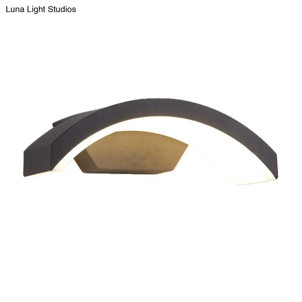 Black curved LED flush wall lamp with white interior and bronze accent panel on Tampa Home & Garden Store