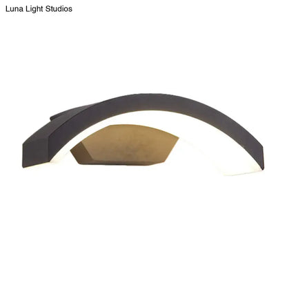 Black curved LED flush wall lamp with white interior and bronze accent panel on Tampa Home & Garden Store