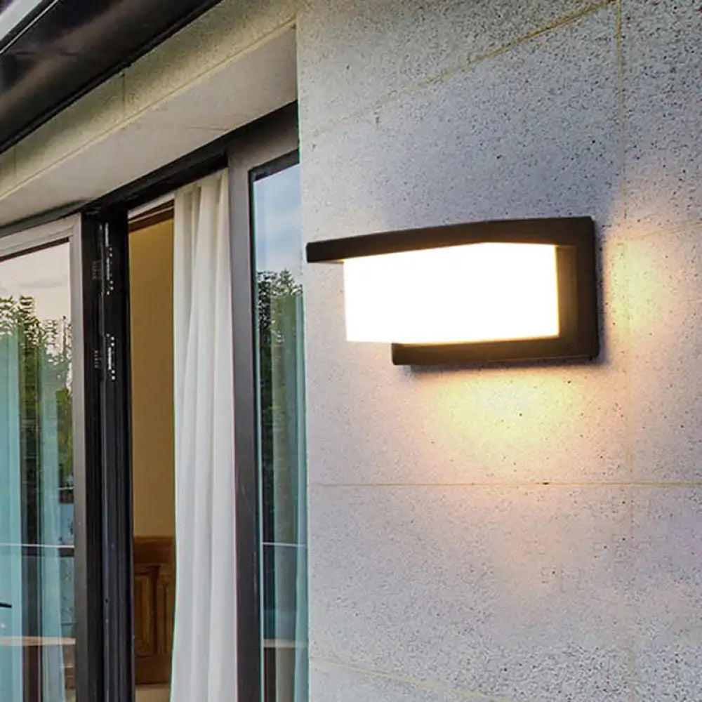 Black LED flush wall lamp by Decorbites on exterior wall beside sliding glass door on Tampa Home & Garden Store