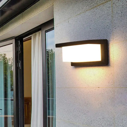 Black LED flush wall lamp by Decorbites on exterior wall beside sliding glass door on Tampa Home & Garden Store