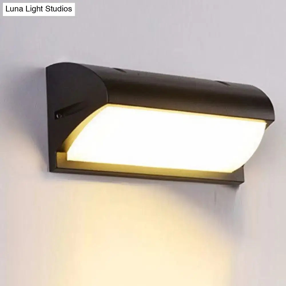 Black LED flush wall lamp with curved housing and warm white diffuser on Tampa Home & Garden Store
