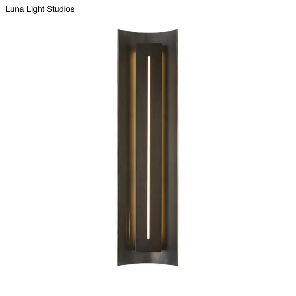 Decorbites black metal wall lamp with slim vertical light slot in a tall rectangular frame on Tampa Home & Garden Store