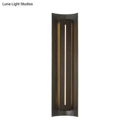 Decorbites black metal wall lamp with slim vertical light slot in a tall rectangular frame on Tampa Home & Garden Store