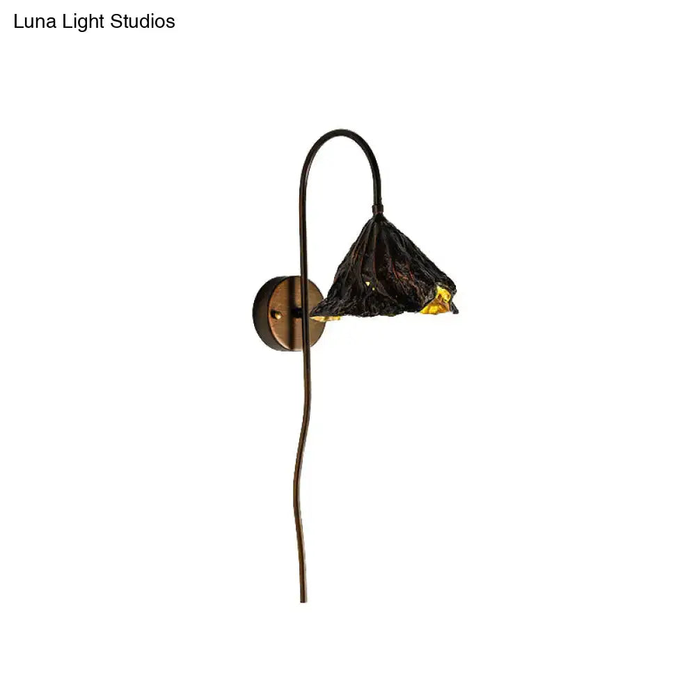 Decorbites Black Lotus Leaf LED wall sconce with bronze curved arm and textured black shade on Tampa Home & Garden Store