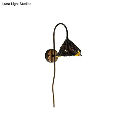 Decorbites Black Lotus Leaf LED wall sconce with bronze curved arm and textured black shade on Tampa Home & Garden Store