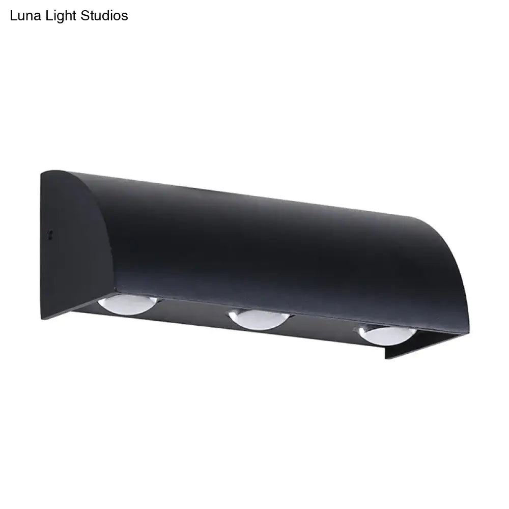 Black metal wall sconce with curved hood and three downlights by Decorbites on Tampa Home & Garden Store