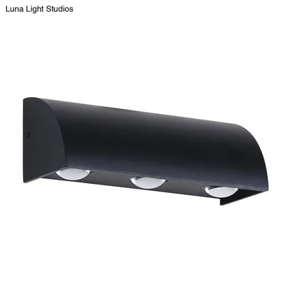 Black metal wall sconce with curved hood and three downlights by Decorbites on Tampa Home & Garden Store