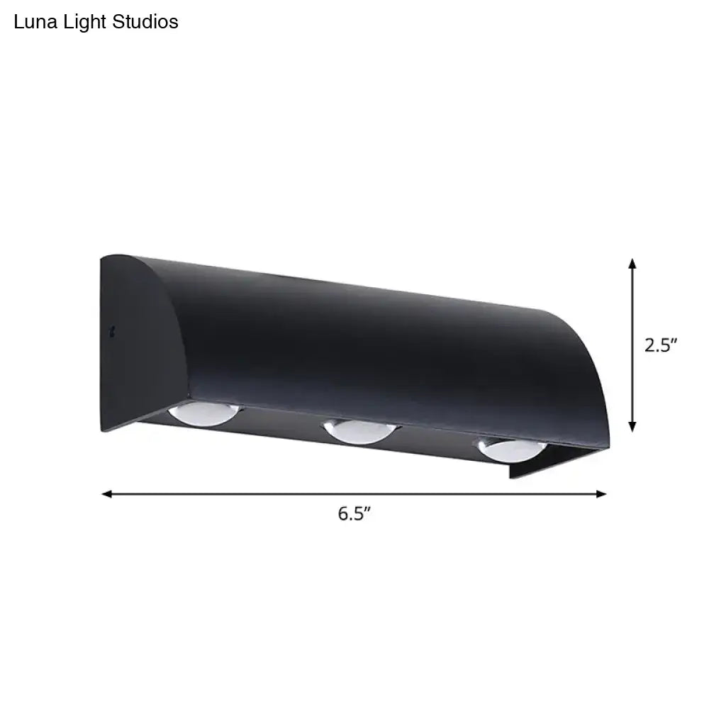 Black metal wall sconce with curved hood and three downward lights Decorbites on Tampa Home & Garden Store