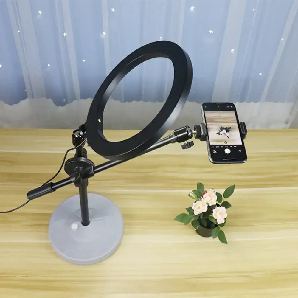 Black round vanity light with adjustable phone mount on a metal stand Decorbites on Tampa Home & Garden Store