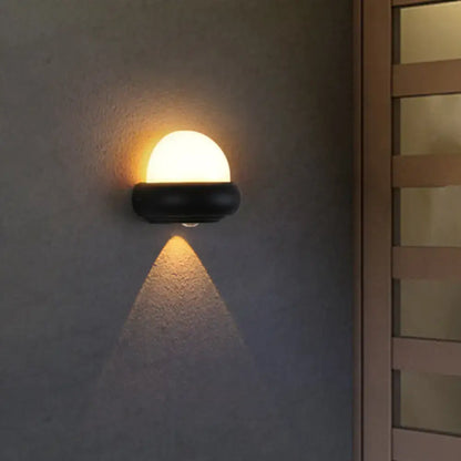 Black semi-sphere outdoor wall light by Decorbites with white globe, wall-mounted sconce on Tampa Home & Garden Store