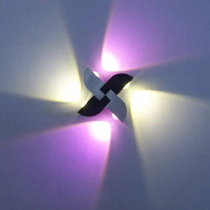 Black silver windmill wall sconce by Decorbites with metal blades and purple glow on Tampa Home & Garden Store