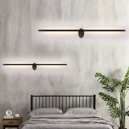 Contemporary black slim wall light pair for bedroom by Decorbites with warm LED glow on Tampa Home & Garden Store