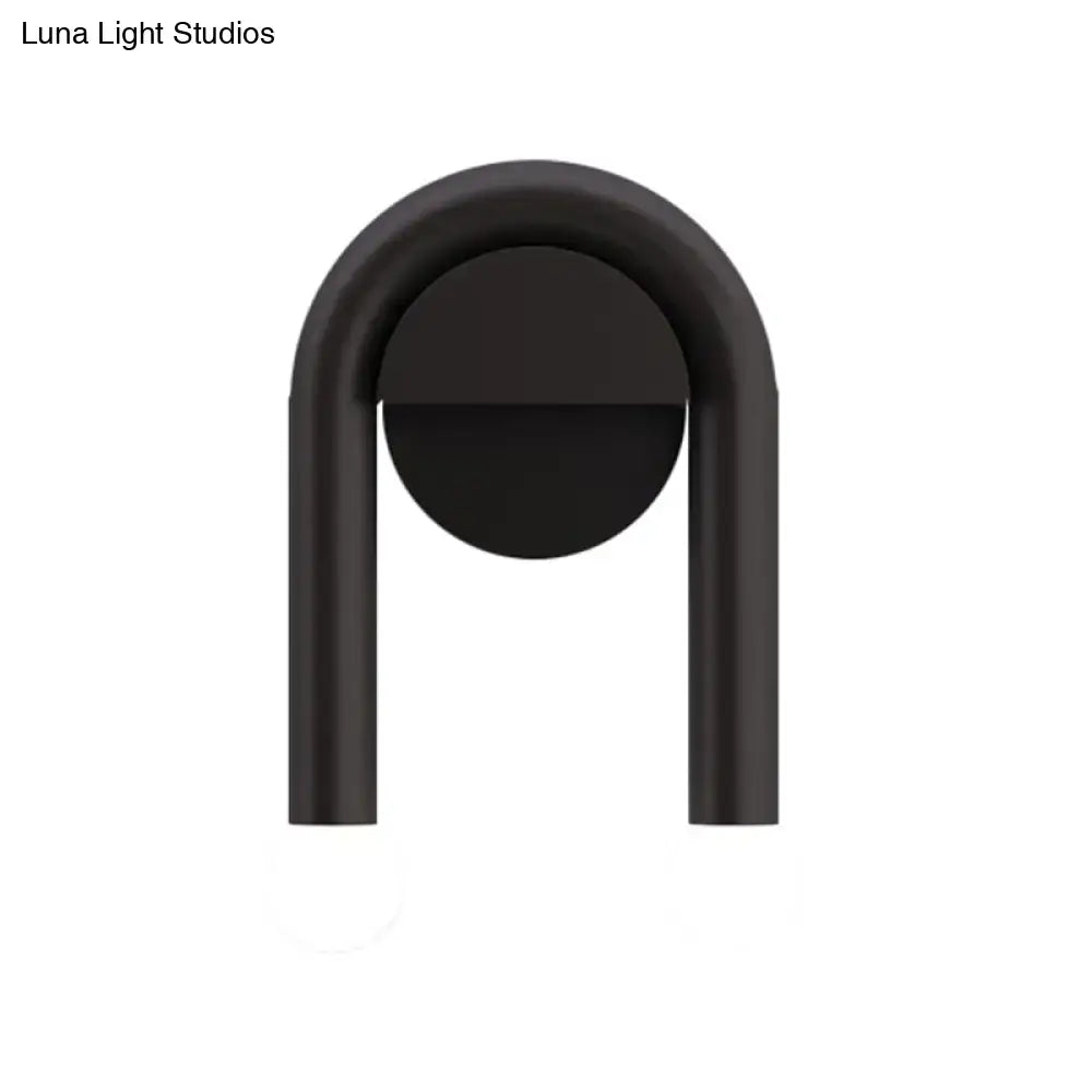 Black U-Shaped Wall Light with matte black metal arch and circular back plate on Tampa Home & Garden Store